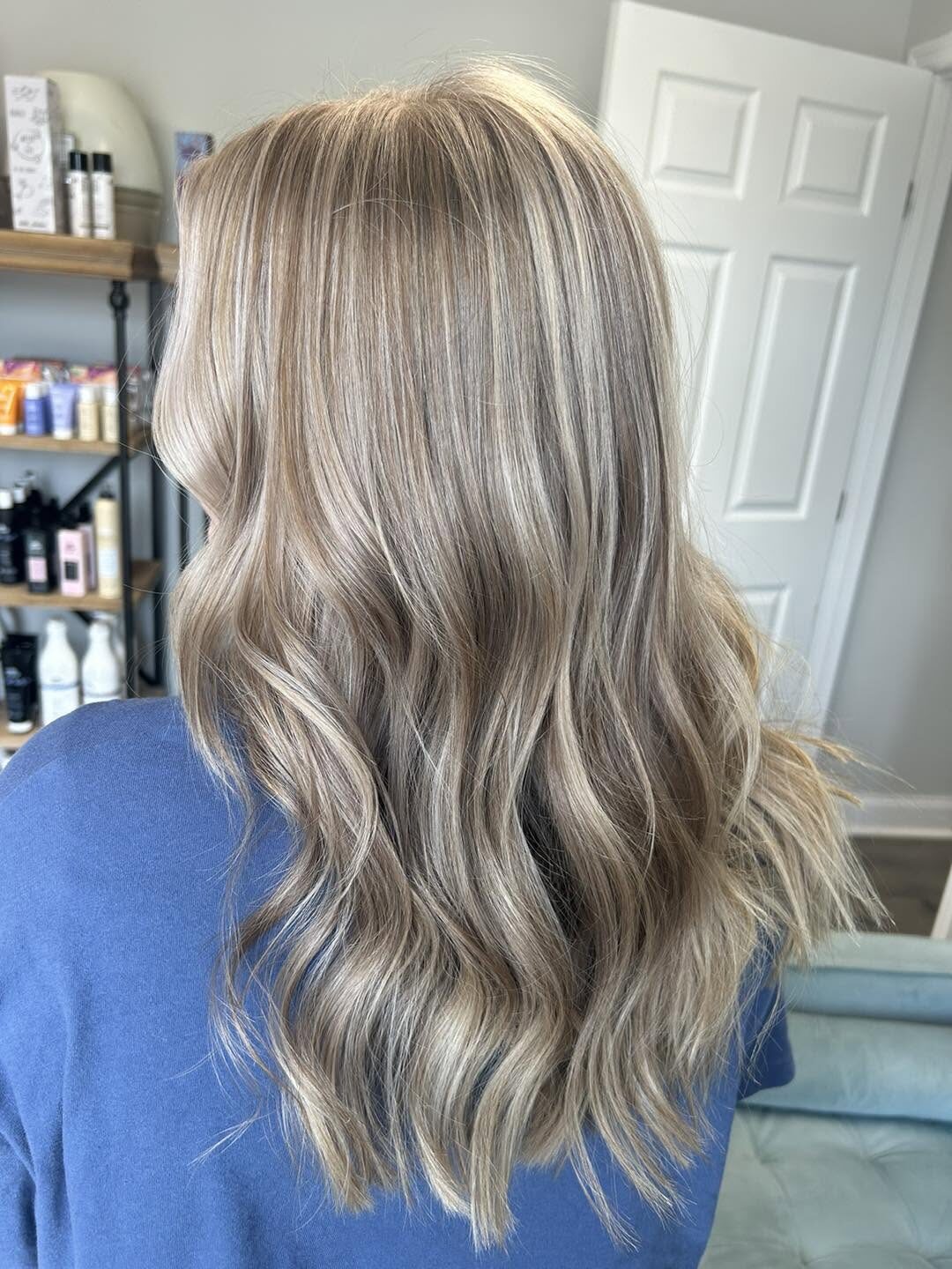 Dimensional ash blonde waves styled at The Loft