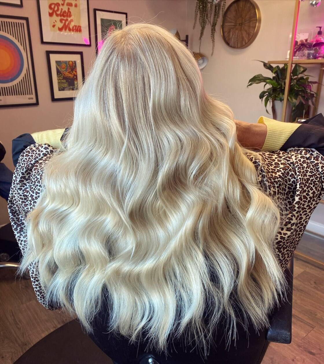 Long platinum blonde waves by Emma Howell