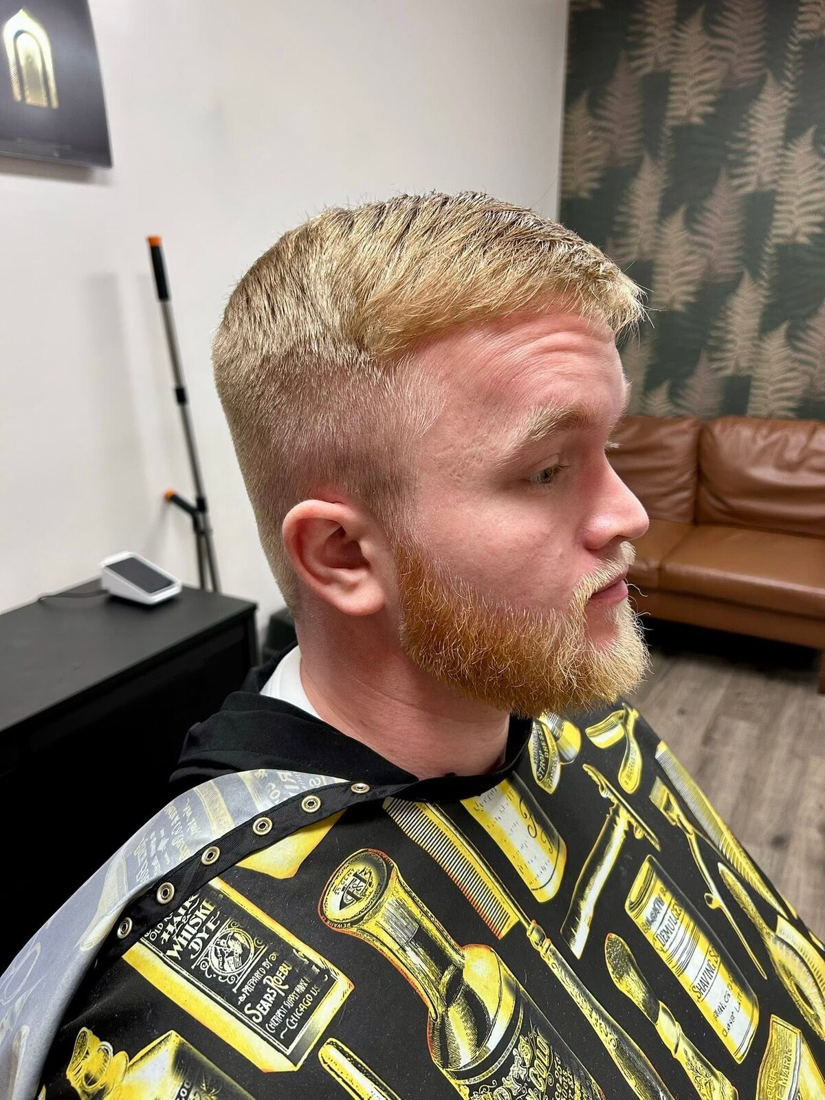 Tight blond crop with faded sides and beard blend by Macy